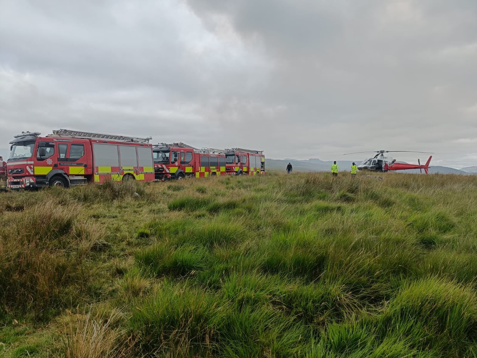 Helicopter and two fire appliances at rhinogydd mountain fire